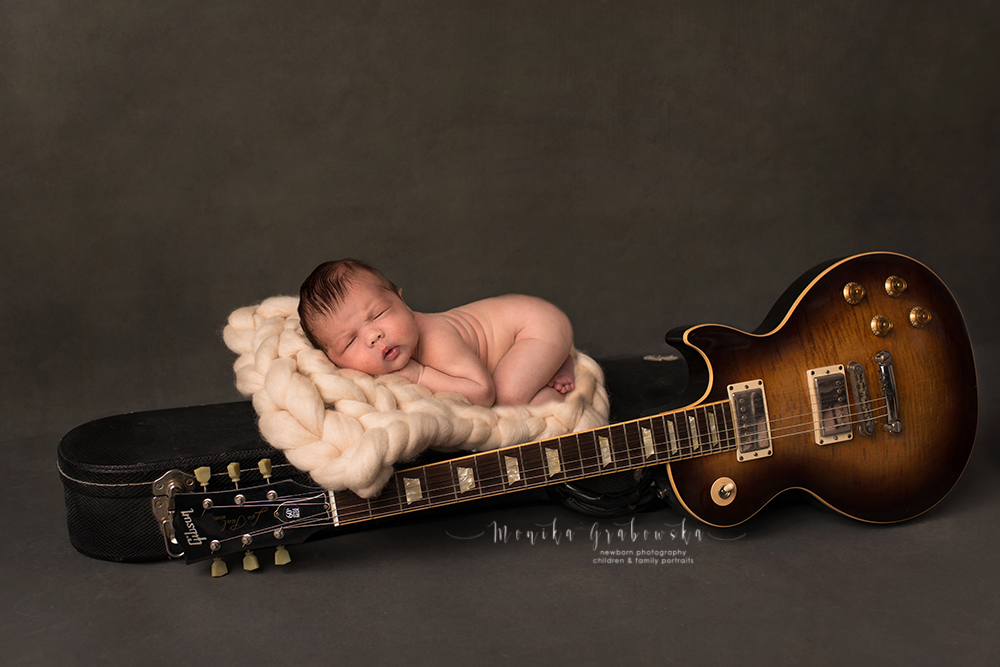 Newborn baby and guitar 